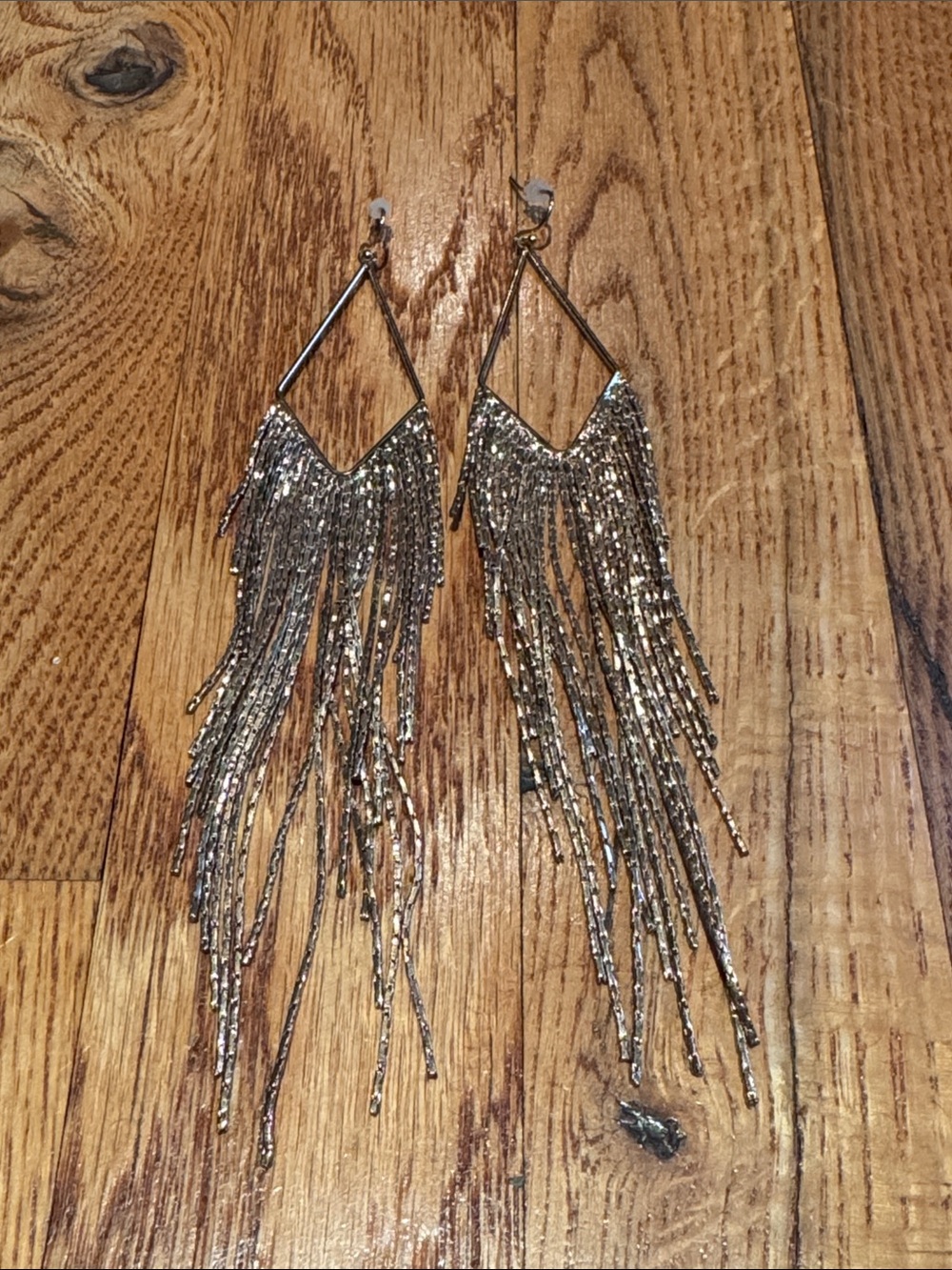 Express diamond shaped gold dangle earrings